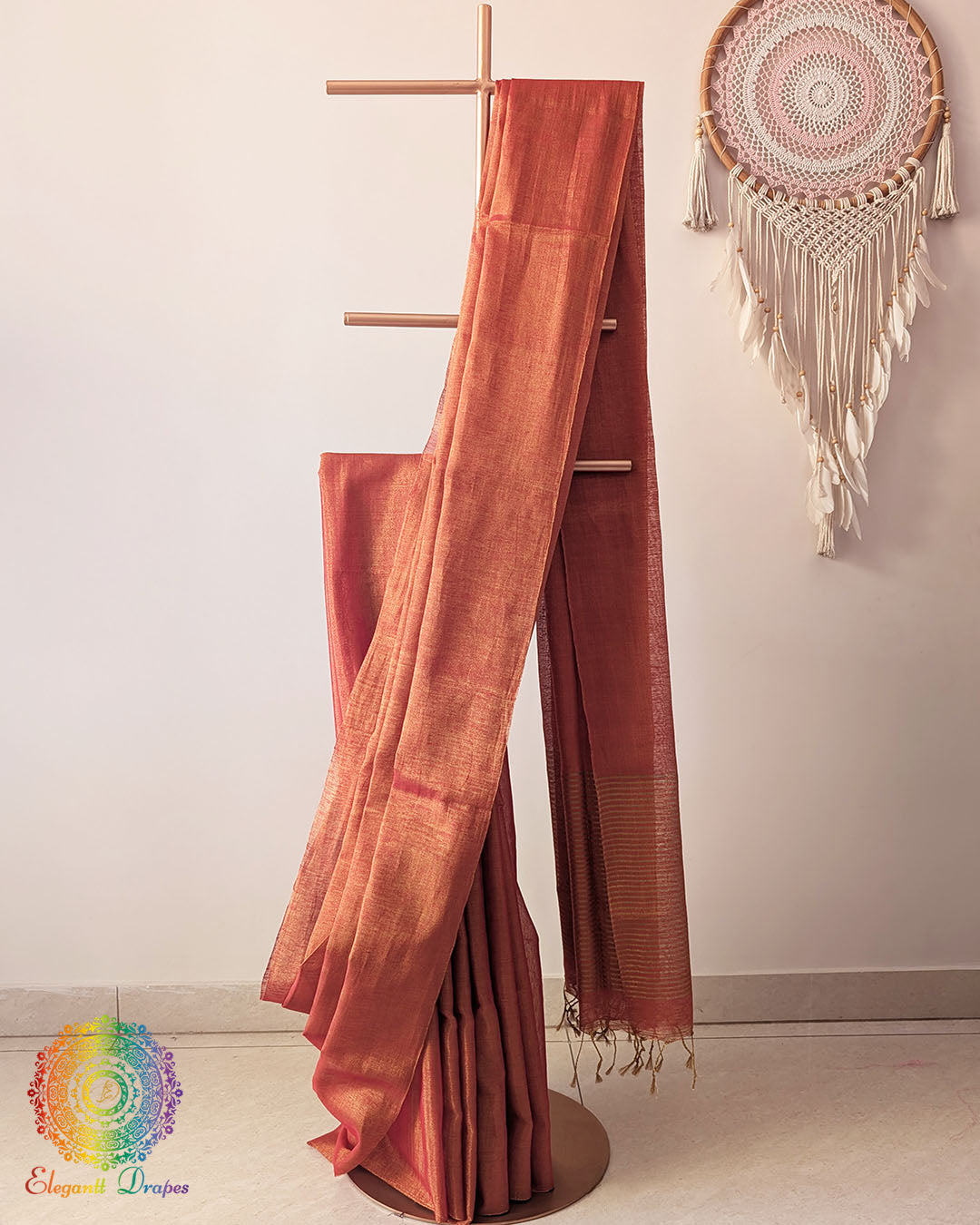 Orange Bengal linen tissue saree showing elegant drape and luminous texture