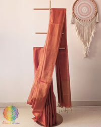 Orange Bengal linen tissue saree showing elegant drape and luminous texture