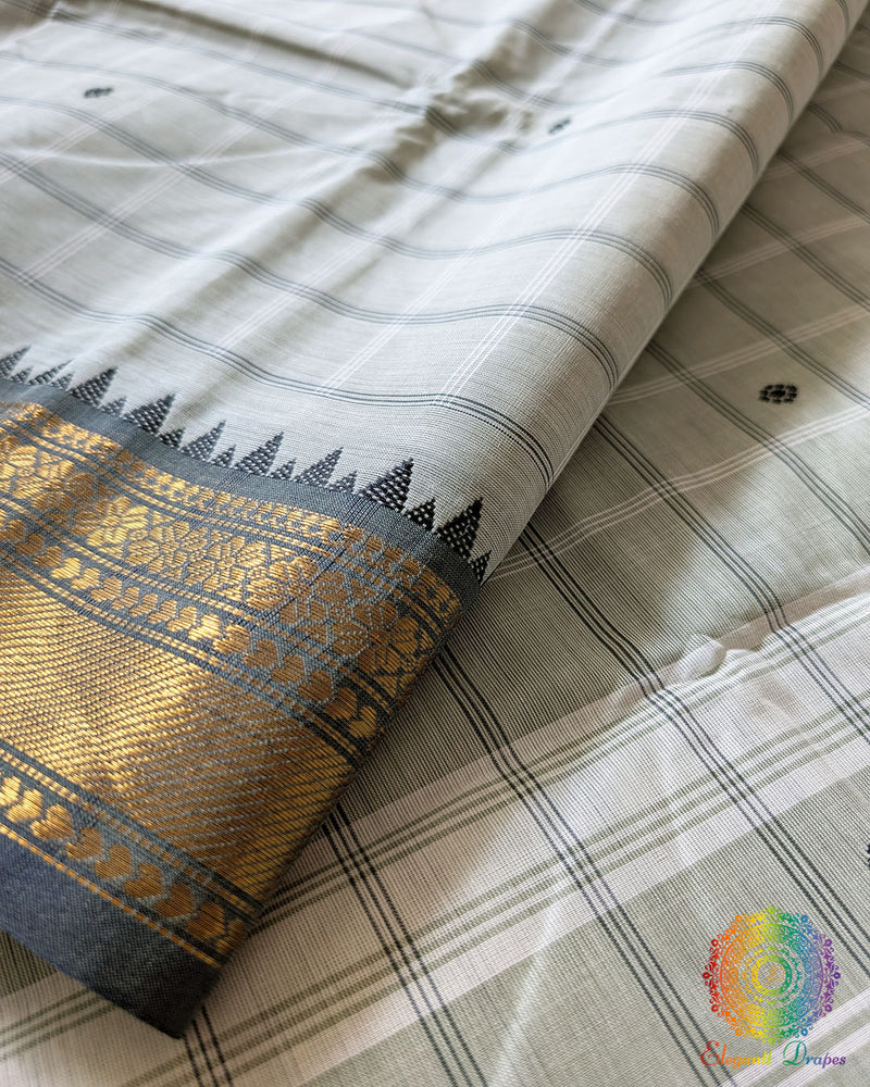 Sage green Kanchi cotton saree close up highlighting all-over checks pattern and fabric texture