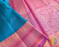 Close up of sapphire blue Kanjivaram silk saree showing thread weave detail