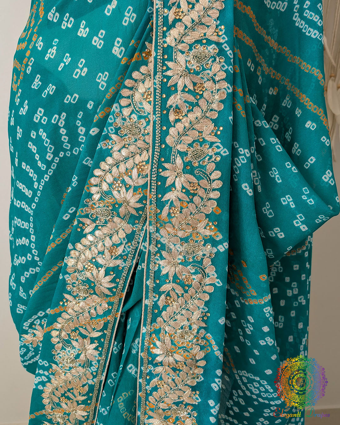 Detailed view of the Gota Patti handwork border on the Turquoise Bandhani Pure Chinon Saree