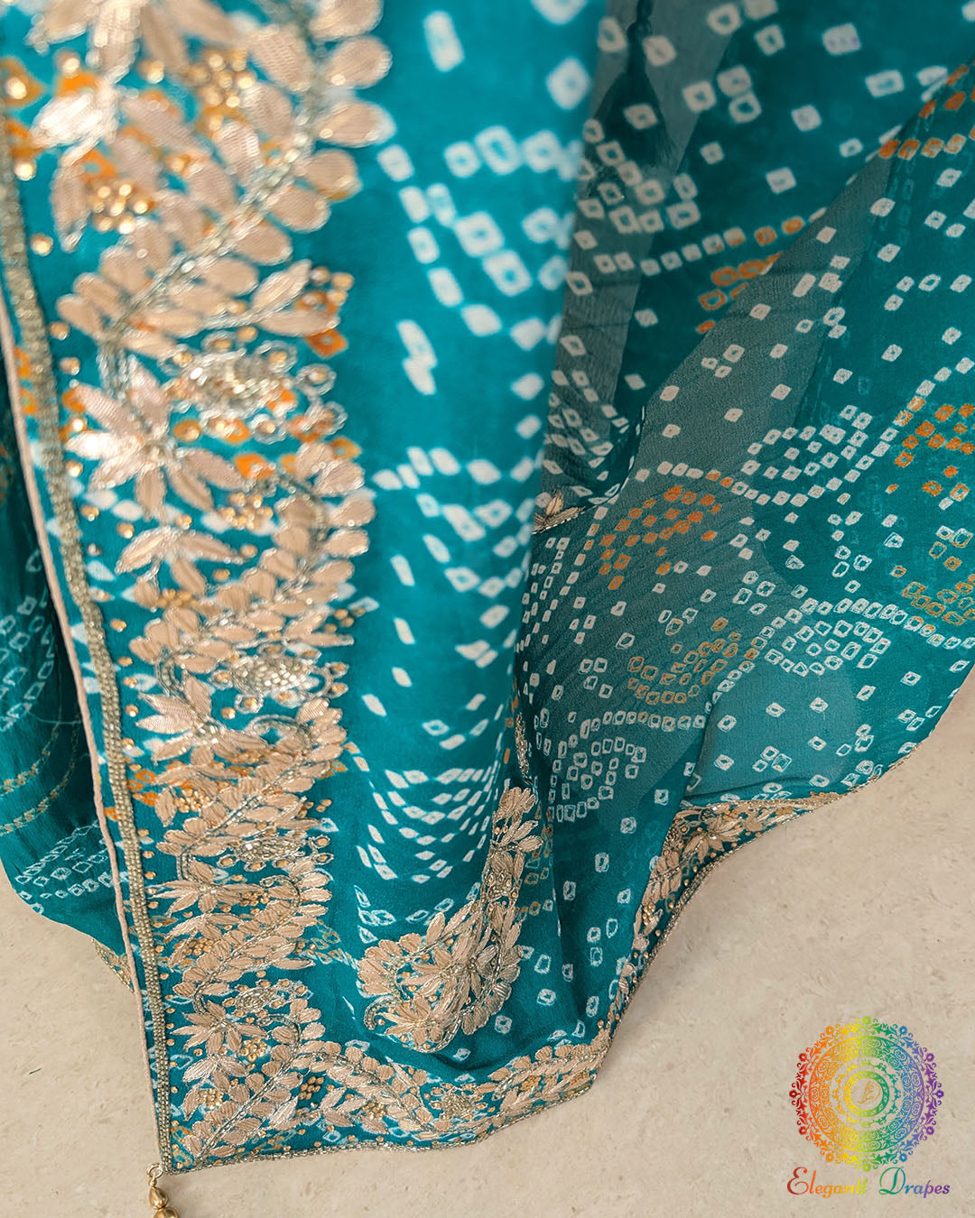 Close-up of handcrafted Gota Patti embroidery on the pallu of the Turquoise Bandhani Pure Chinon Saree