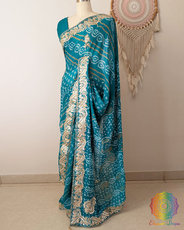 Side view of the Turquoise Bandhani Gota Patti Pure Chinon Saree highlighting its graceful drape