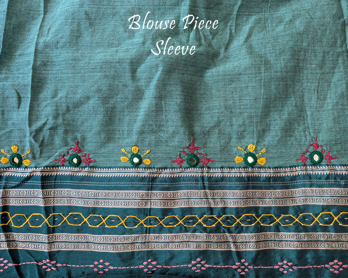 Matching blouse sleeve featuring intricate handcrafted Lambani embroidery that highlights the fine artisan craftsmanship and coordinated design of the saree ensemble.
