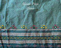 Matching blouse sleeve featuring intricate handcrafted Lambani embroidery that highlights the fine artisan craftsmanship and coordinated design of the saree ensemble.