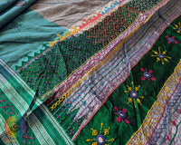 Close-up of intricate multicolored Lambani hand embroidery on the richly embellished palla