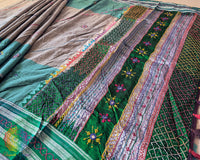 Close-up of intricate multicolored Lambani hand embroidery on the richly embellished palla