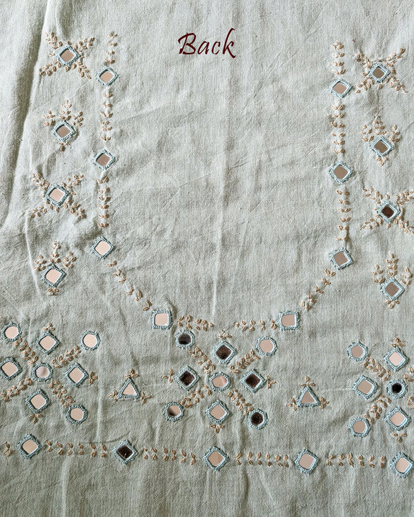 Back view of the Sea Green Kala Cotton Kutch Mirror Handwork blouse piece, showcasing intricate Kutch embroidery and real mirrors arranged in a decorative handcrafted design.