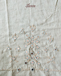 Sleeve detail of the Sea Green Kala Cotton Kutch Mirror Handwork blouse piece, highlighting the real mirror embellishments, detailed threadwork and refreshing sea green cotton fabric.