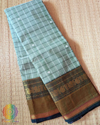 Folded sea green pure Kanchi cotton checkered saree showing woven checks pattern