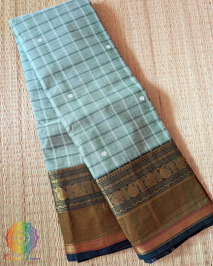 Folded sea green pure Kanchi cotton checkered saree showing woven checks pattern