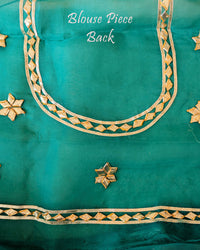 Sea Green Organza Leheria Saree – Blouse back view featuring the coordinated fabric and traditional festive detailing