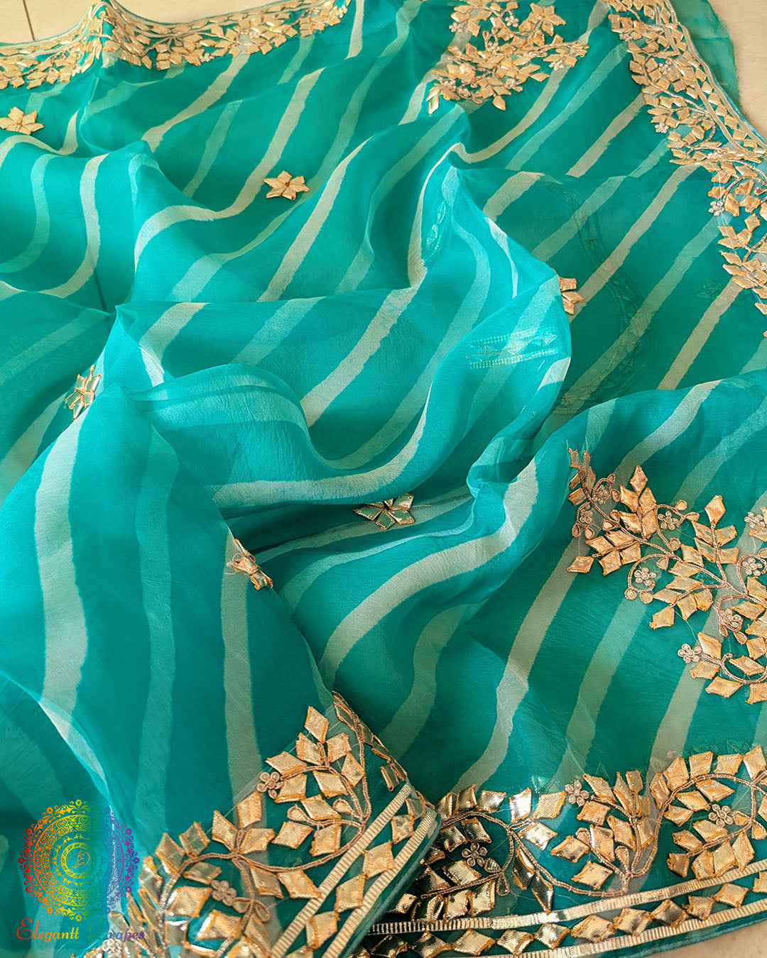 Sea Green Organza Leheria Saree – Detailed body view showcasing the graceful wave-like Leheria pattern and shimmering Kachha Gota work