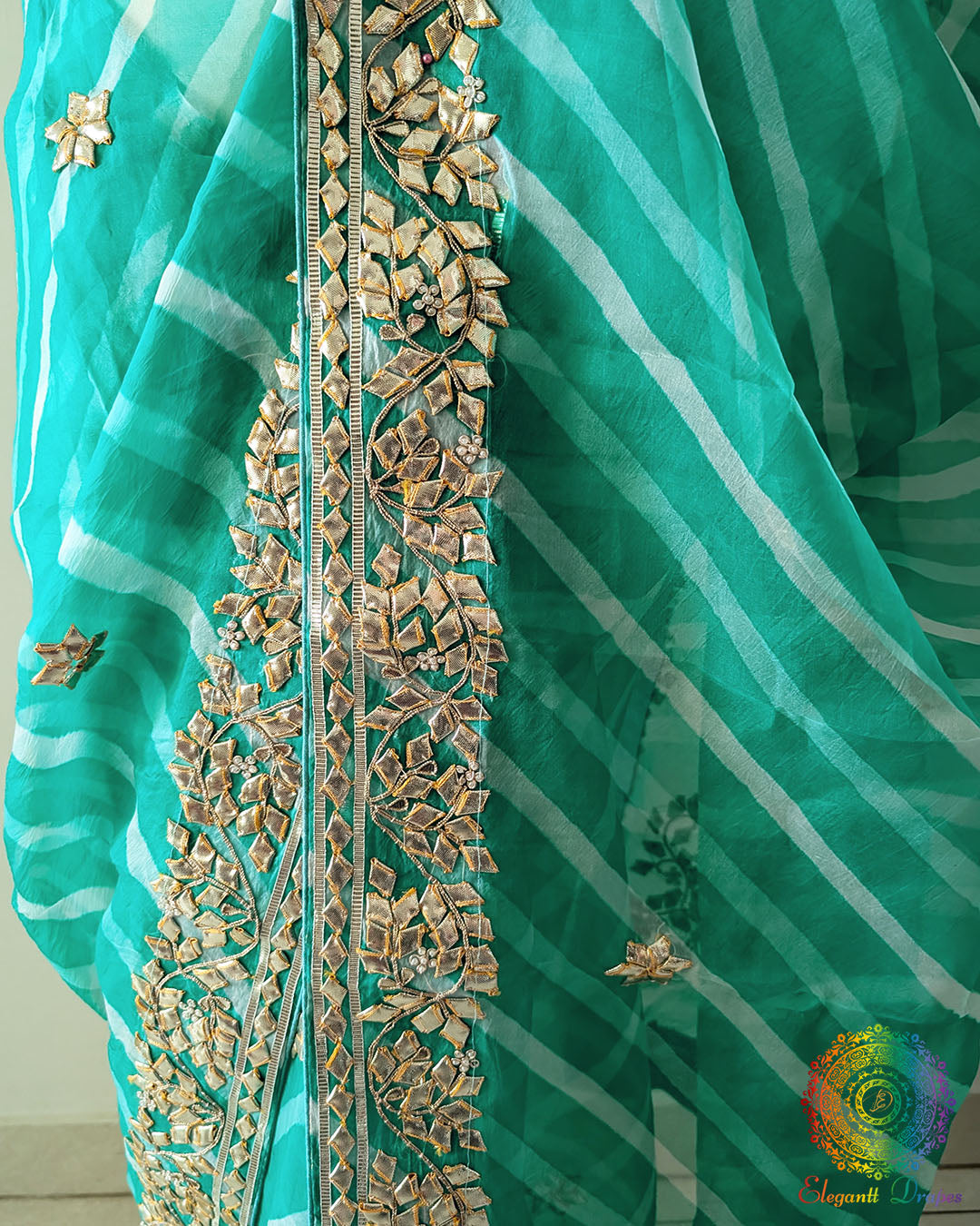 Sea Green Organza Saree – Close view of handcrafted Kachha Gota embellishment arranged over the traditional Leheria pattern
