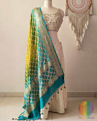 Sea green Banarasi georgette Gharchola Bandhani dupatta with yellow shading, zari border, and kodi tassels
