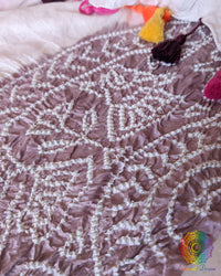 Detailed view of the mauve and pink Bandhani motifs on the White Gajji Silk Dupatta, showcasing the soft colour accents against the crisp white base.