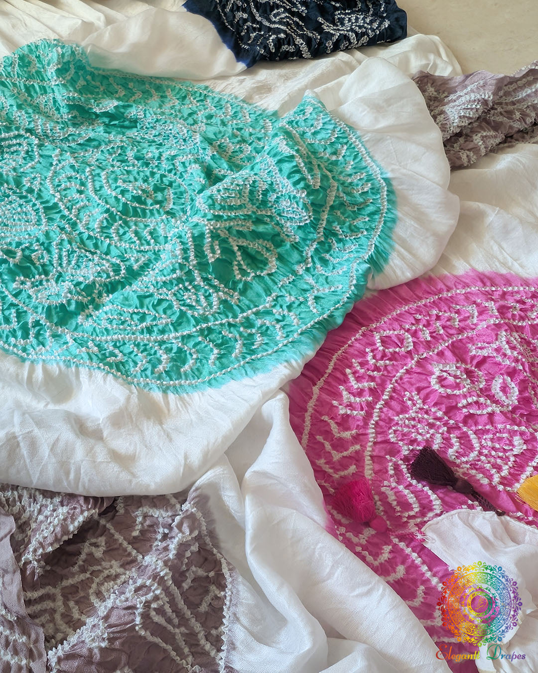 Close-up of the green and sea green Bandhani motifs on the White Gajji Silk Dupatta, highlighting the multicolour pattern and traditional tie-dye detailing.