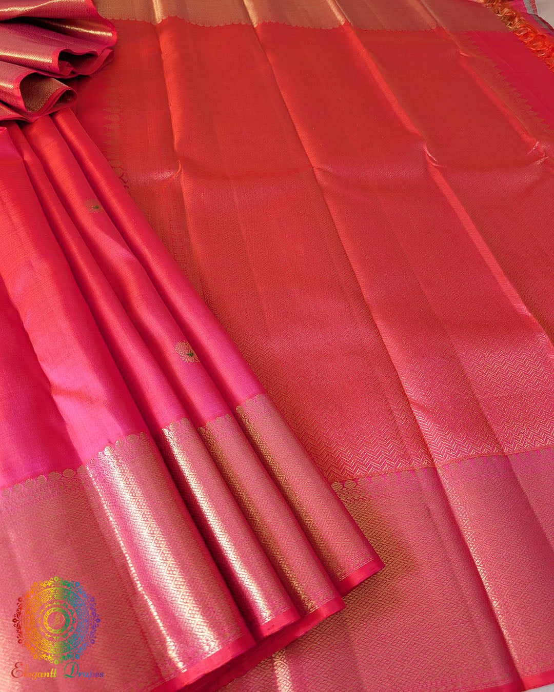Close-up of the palla of the Shot Pink Pure Kanjivaram Silk Saree, highlighting the 2gm gold zari detailing against the pink-orange shot silk.