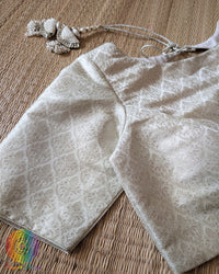 Sleeve detail of the Off White Banarasi Brocade Designer Blouse with silver zari woven paisley motifs