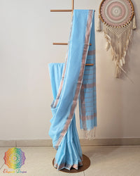 Sky blue Bengal cotton saree with zari border on mannequin showing full drape
