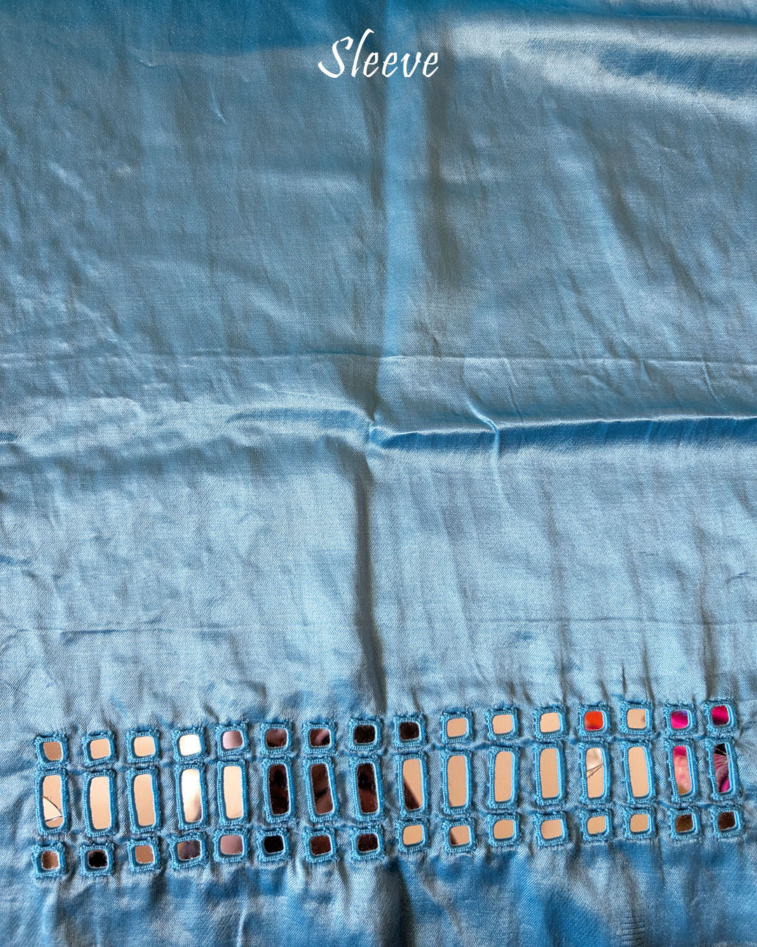Close-up of Kutch mirror embroidery on sleeve of Blue Mashru Silk Blouse Piece