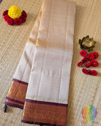 Taupe Maroon Pure Kanjivaram Handloom Silk Saree – Folded View showcasing the elegant taupe silk body, contrasting maroon border and traditional 2gm gold zari detailing.