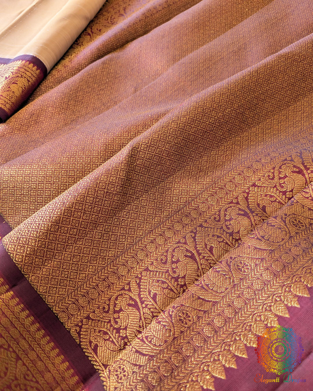 Taupe Maroon Handloom Kanjivaram Saree – Detailed Palla View highlighting the gold zari patterns across the maroon palla and the contrast with the plain taupe silk body.