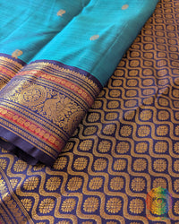 Close-up of the palla of the Teal Blue Pure Kanjivaram Silk Saree, highlighting the 1gm gold zari work and traditional Kanjivaram weaving.