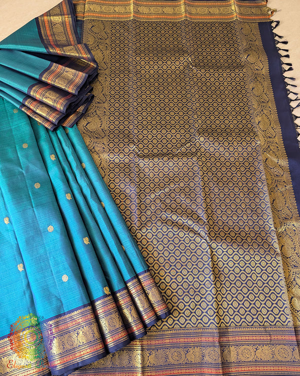 Teal Blue Pure Kanjivaram Handloom Silk Saree shown in a full open view, highlighting the elegant silk fabric, teal blue colour and classic Kanjivaram design.