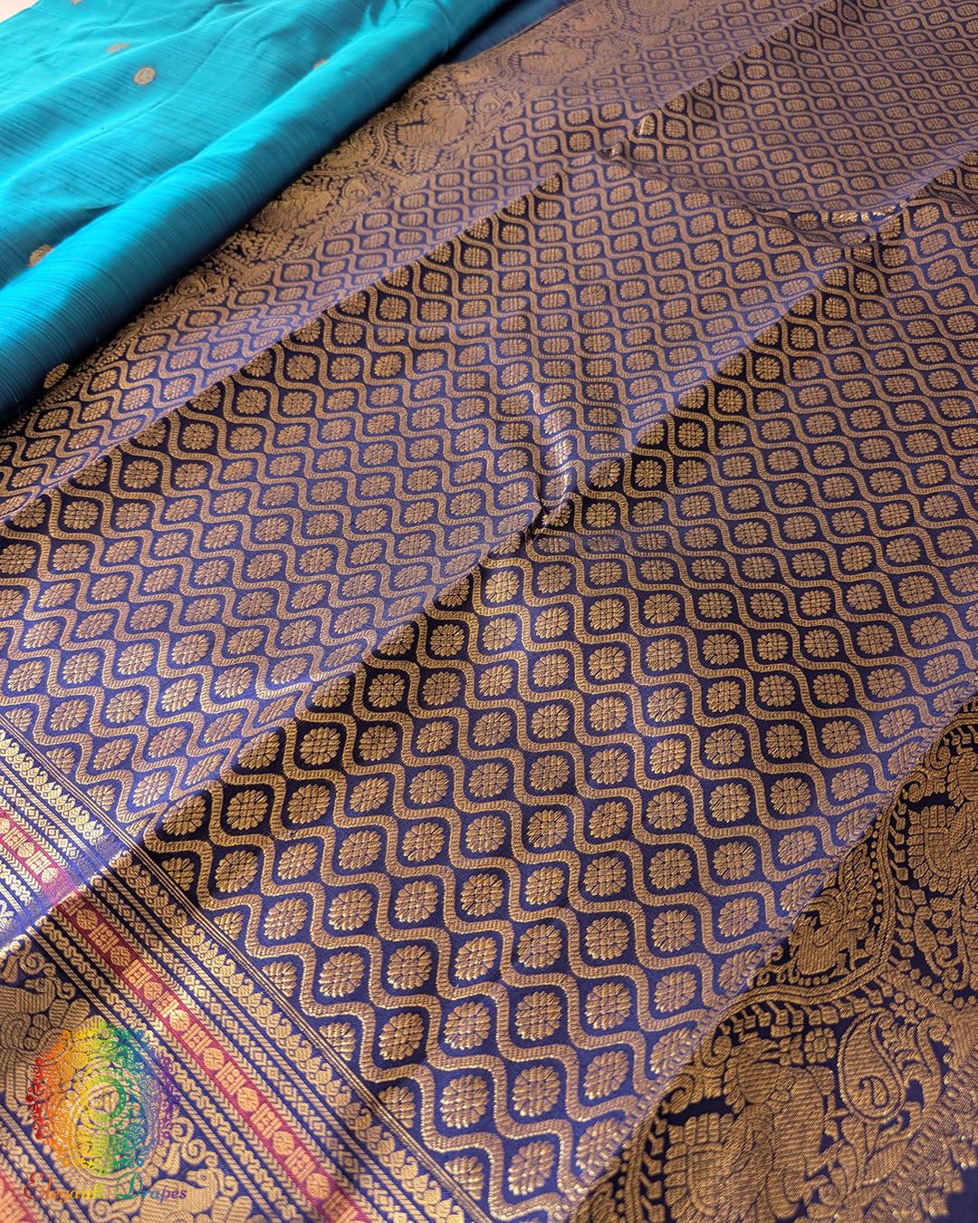 Detailed view of the gold zari border on the Teal Blue Pure Kanjivaram Handloom Silk Saree, showcasing the traditional woven detailing and contrasting golden accents.