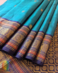 Pleats view of the Teal Blue Pure Kanjivaram Handloom Silk Saree, displaying the overall colour, traditional handloom texture and coordinated gold zari details.