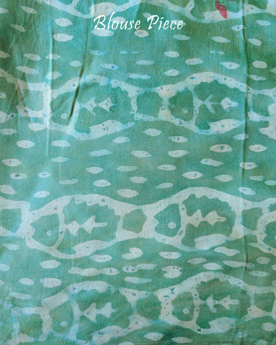Blouse piece of the Terracotta Pink Nashpal Pomegranate Ajrakh Modal Tussar Silk Saree, showing its coordinating terracotta pink shade and matching Ajrakh print.