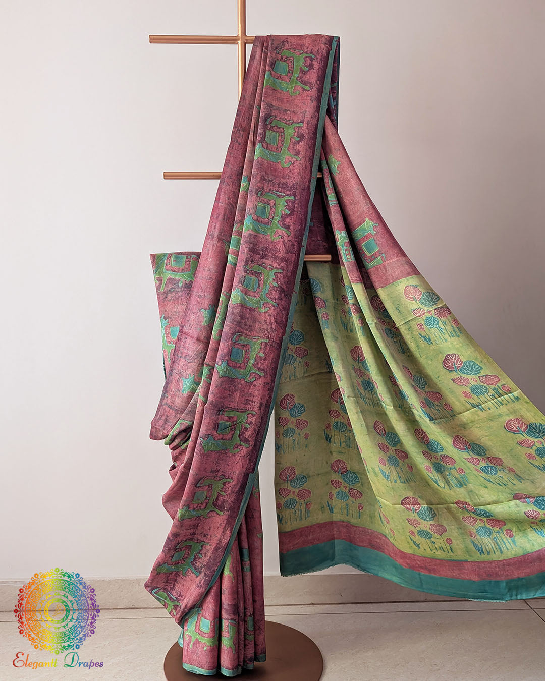 Terracotta Pink Nashpal Pomegranate Ajrakh Modal Tussar Silk Saree with the palla neatly pleated, highlighting the layered fabric and traditional pomegranate Ajrakh detailing.