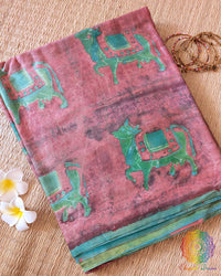 Terracotta Pink Nashpal Pomegranate Ajrakh Modal Tussar Silk Saree folded to display its earthy pink colour, Nashpal Pomegranate Ajrakh print and distinctive striped design.