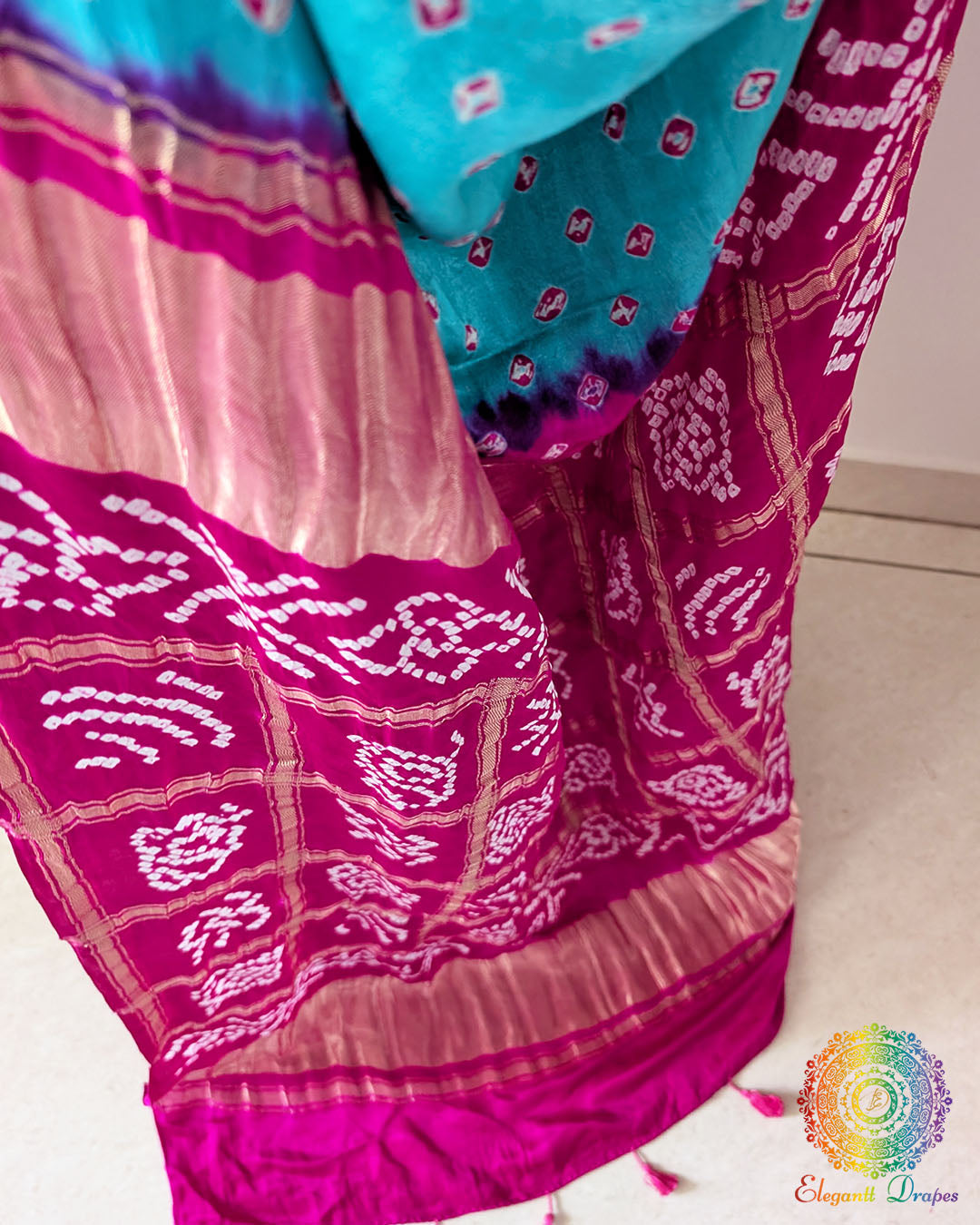 Close-up of pink Bandhani tie-dye motifs on the Turquoise Blue Pure Gajji Silk Saree