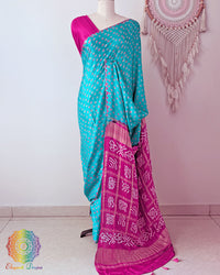 Turquoise Blue Pure Gajji Silk Bandhani Saree with Gharchola Pallu front drape