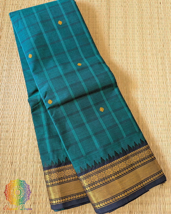 Folded turquoise pure Kanchi cotton checkered saree showing woven checks pattern