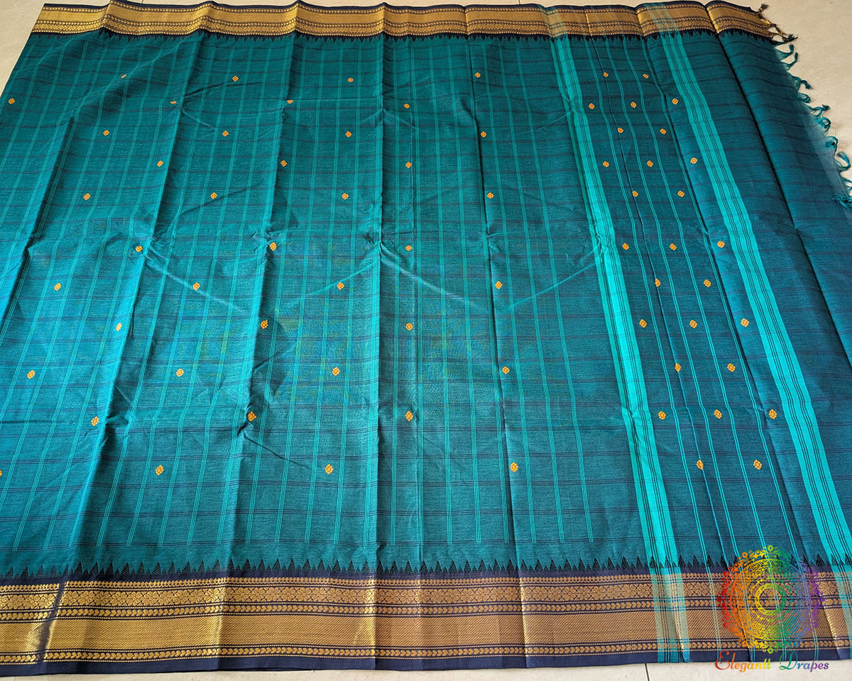 Full turquoise Kanchi cotton checkered saree laid open showcasing overall design and drape