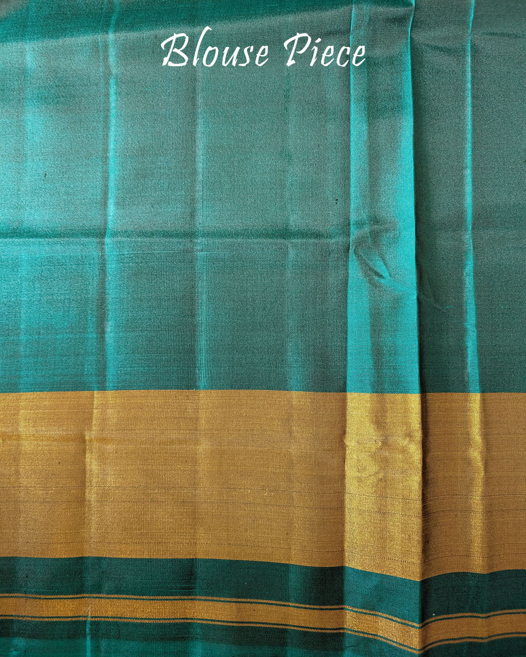 Matching blouse piece in turquoise pure mulberry silk fabric with Patola woven detailing