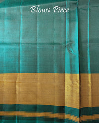 Matching blouse piece in turquoise pure mulberry silk fabric with Patola woven detailing