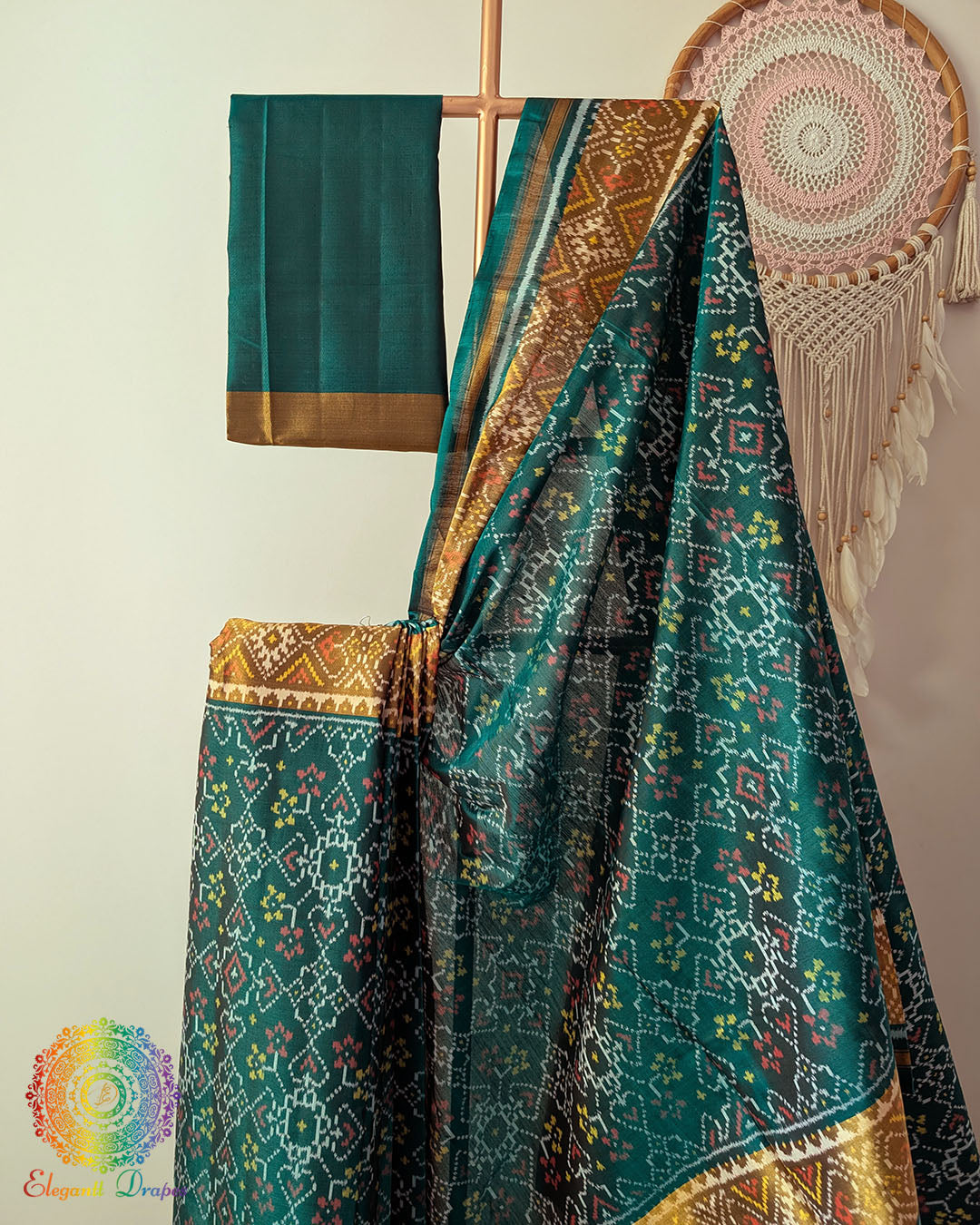 Close up of traditional Rajkot Patola weaving on turquoise pure mulberry silk saree