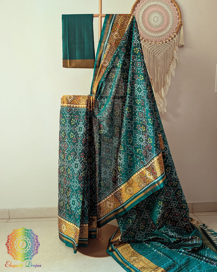 Turquoise handwoven mulberry silk Rajkot Patola saree on mannequin showing full drape