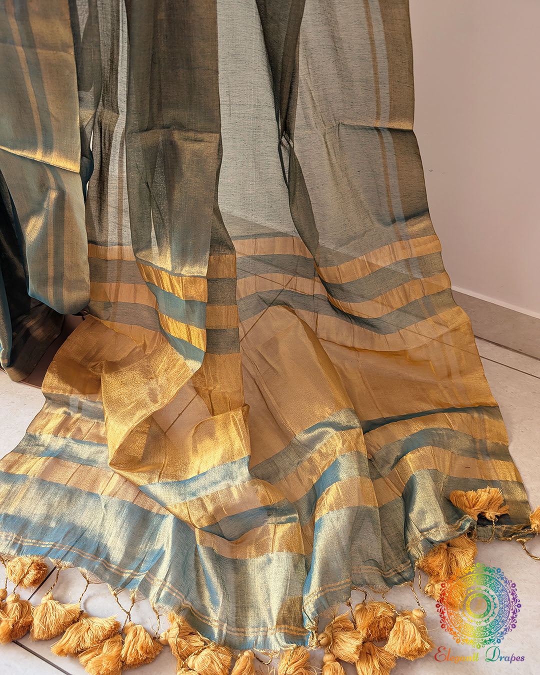 Pom pom detailing on turquoise saree