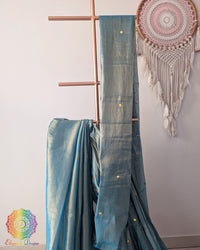 Close up of aqua blue Bengal mul tissue saree with sequins work