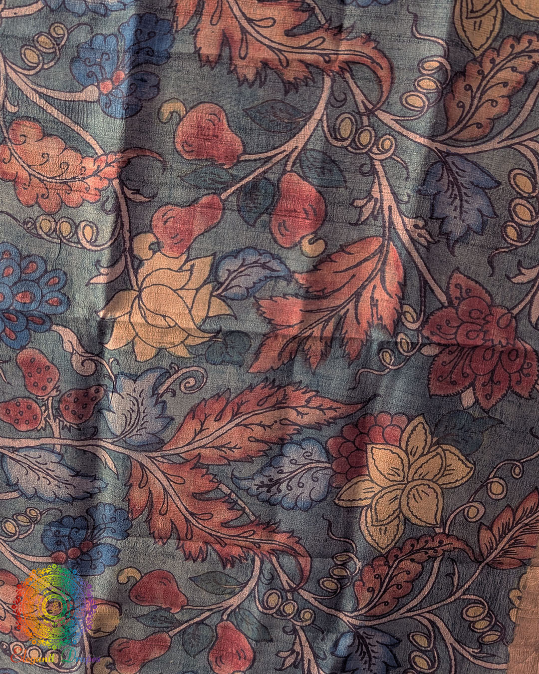 Close-up of authentic hand-painted Kalamkari artwork highlighting the rich texture and natural sheen of Turquoise Pure Tussar Silk dupatta