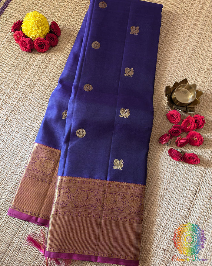 Violet Pure Kanjivaram Handloom Silk Saree – Folded View showcasing the rich violet silk fabric, traditional Kanjivaram weave and elegant 2gm gold zari detailing that adds a classic festive finish.