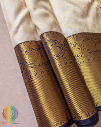 Detailed view of woven zari motifs on blue border of Kanjivaram silk saree