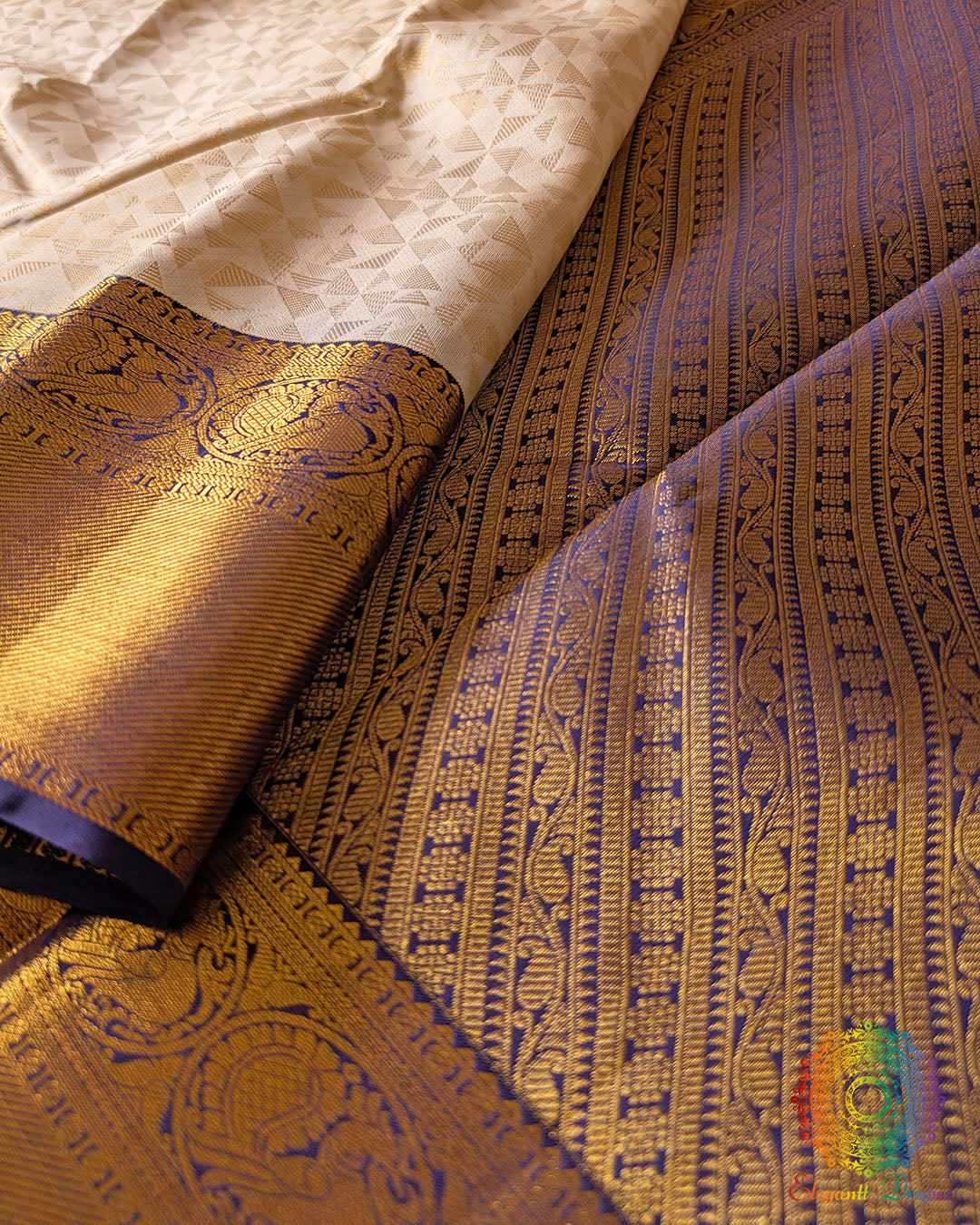 Blue border close up on off white Kanjivaram silk saree highlighting 2 gram zari weaving