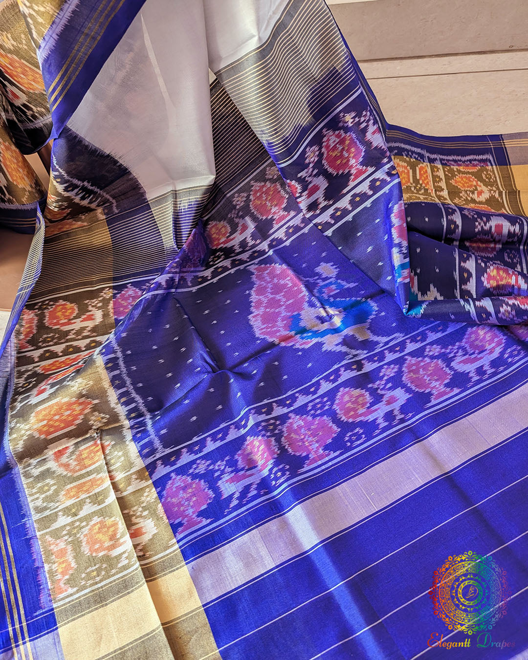 White Blue Rajkot Patola Silk Saree – Palla Close-Up highlighting the intricate geometric motifs and traditional patterns woven across the palla, showcasing the detailed craftsmanship of this Gujarati silk saree.