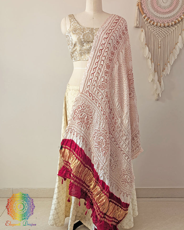 White gaji silk bandhani dupatta with red palla traditional tie and dye Elegantt Drapes